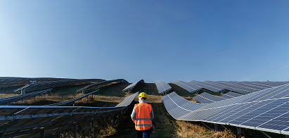 person-near-alternative-energy-plant